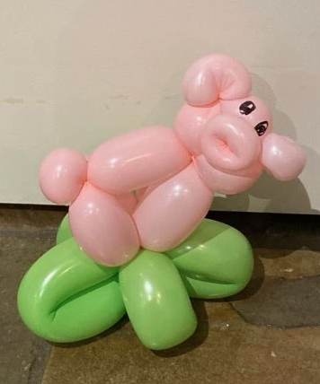 Pink and green balloon dog creation